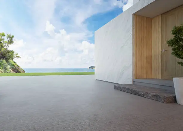 Photo of Luxury beach house with sea view and wooden door in modern design.