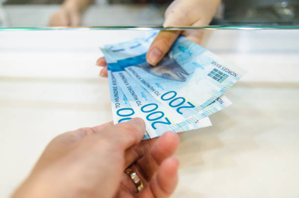 istock Exchange money for Norway money or Norwegian krone. 1330688410