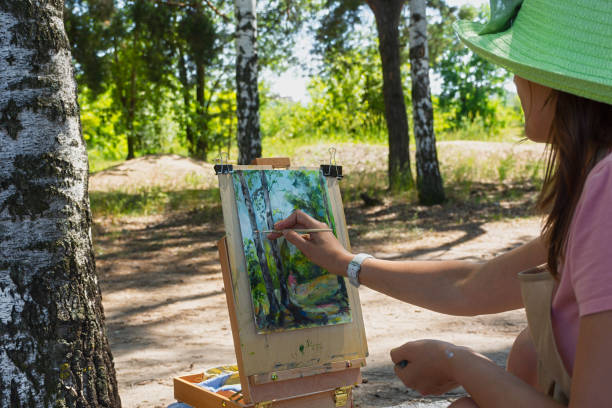 istock A young woman draws plein air. 1330688756