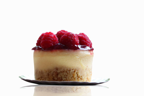 Raspberries sweet cake small baked dicut and reflection technique on white background isolate