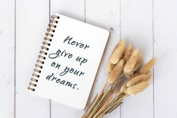 istock Never give up on your dreams inspirational quote 1330689628