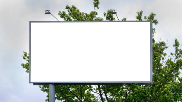 istock advertisement banner of white colour located near green tree 1330690041
