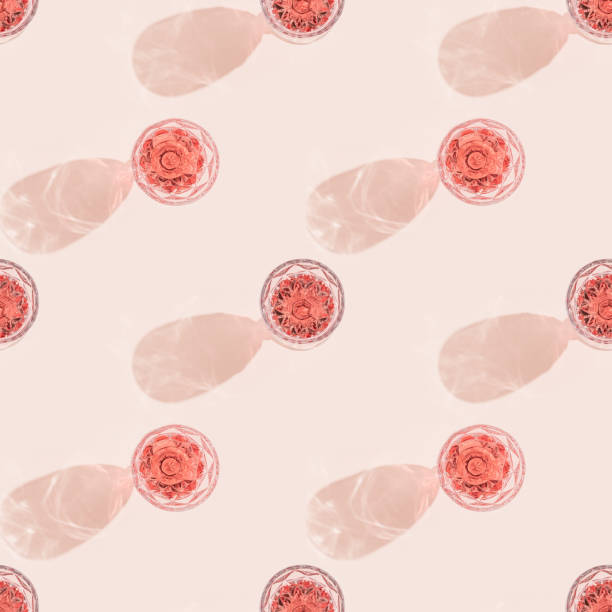 pattern with wineglass close up, glass of rose wine in bright sunlight with shadow. summer alcohol drinks concept. - pink champagne fotos imagens e fotografias de stock