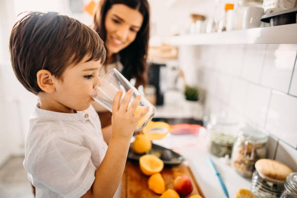 istock Mother and child making lemonade 1330693045