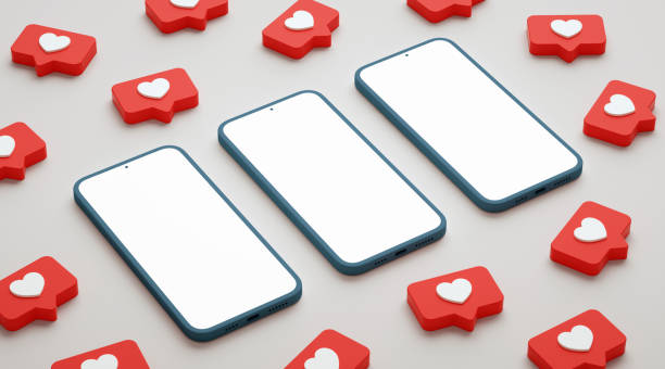 istock Three blank screen phone mockup surrounded by social media likes. Smartphone display with social network heart button, realistic presentation template in 3D rendering 1330693200