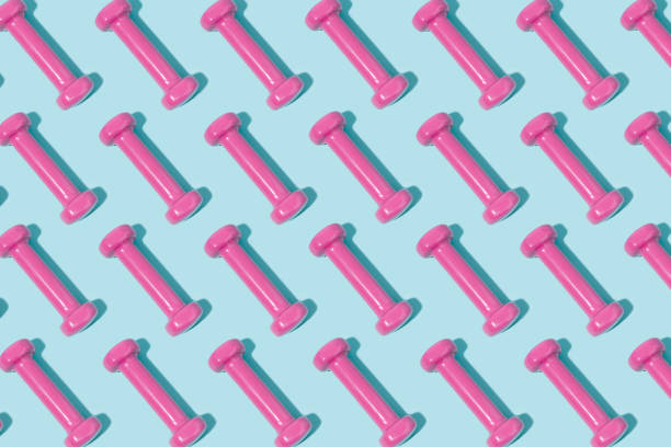istock Pink dumbbell pattern on blue background. Sport and exercise. 3d illustration 1330694322