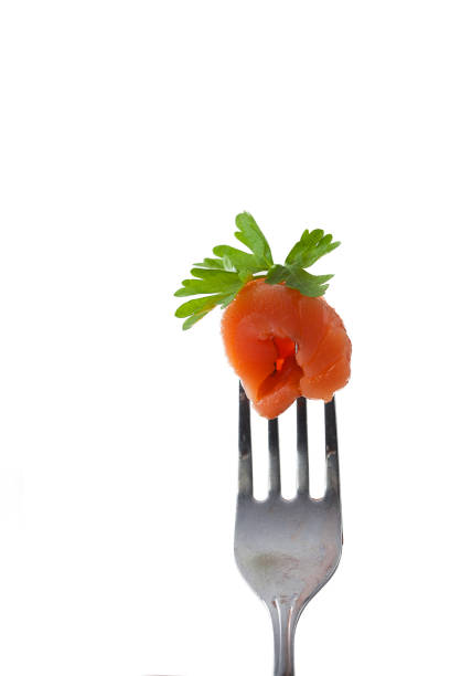 istock One slice of fresh salmon fillet on a fork 1330697797