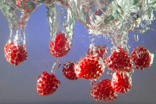 istock Beautiful ripe berries in water in air bubbles 1330698605
