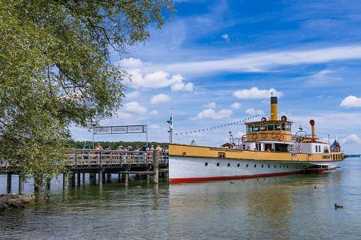 A steamboat at a landing stage on lake Chiemsee, Insel Herrenchiemsee, Bavaria, Germany, Europe