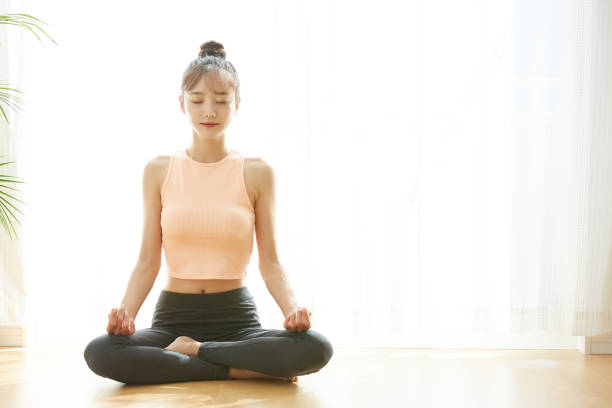 istock A young Asian woman exercising at home 1330700634