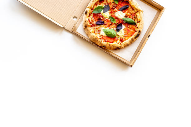 istock Delicious pizza with cheese tomatoes sauce and basil 1330700720