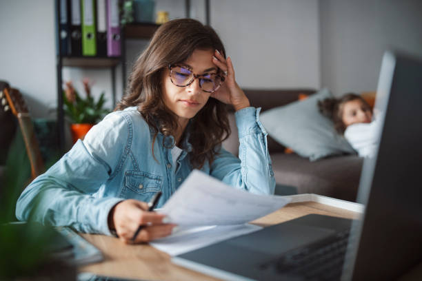 istock Woman working from home and looking after her child 1330704667