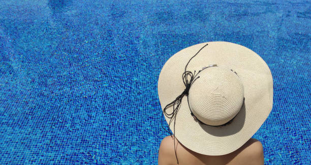 istock Woman relaxing in the swimming pool 1330706331