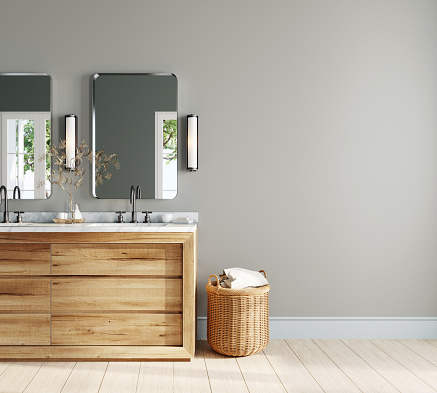 Diseño interior de baño moderno con tocador de madera y cesta de ratán photo