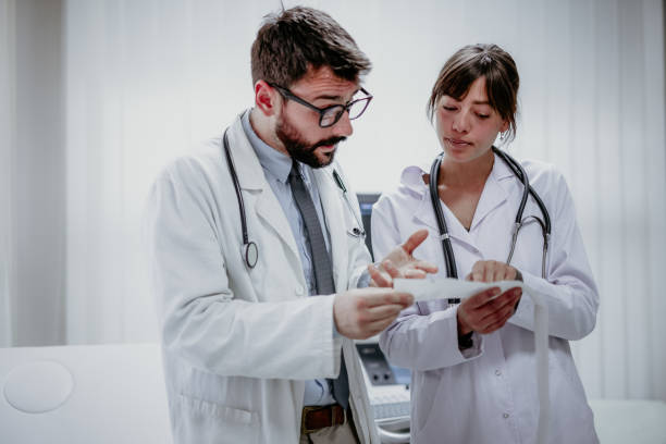 istock Nurse and doctor brainstorming in ordination 1330708161