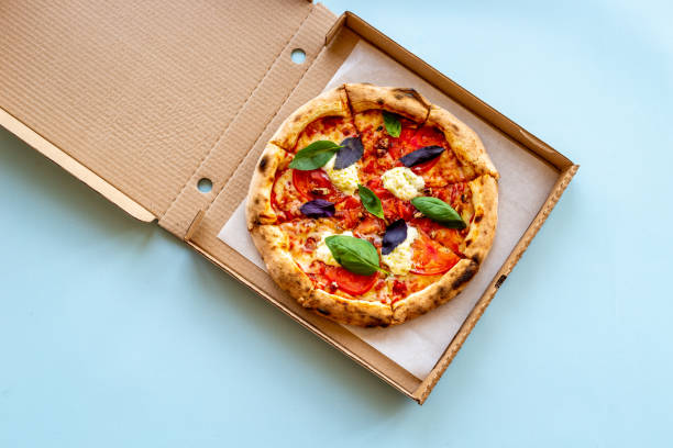 Homemade italian pizza margherita with tomatoes cheese and basil, top view
