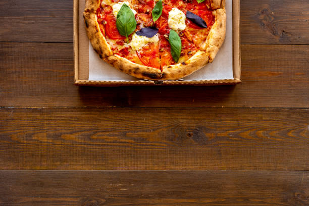 Margherita italian pizza with tomatoes cheese and basil, top view