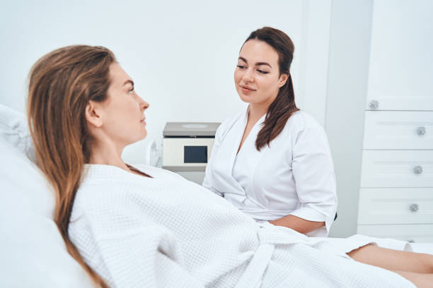 istock Concentrated female patient looking at her specialist 1330710182