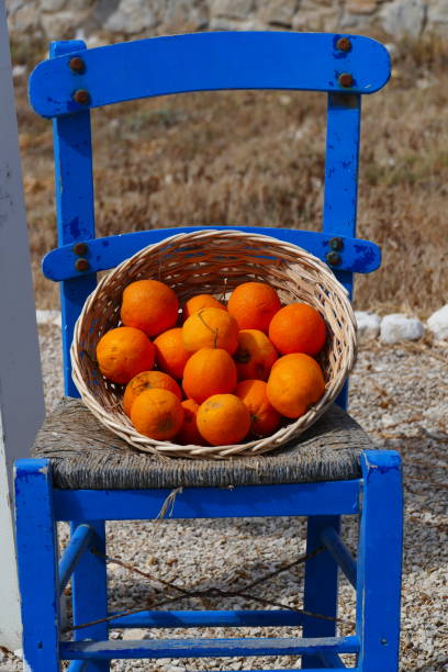 istock Oranges on a Greek chair 1330710753