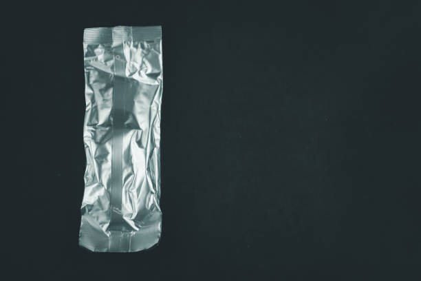 istock Packing aluminium on black background. Packaging template mockup. 1330711668