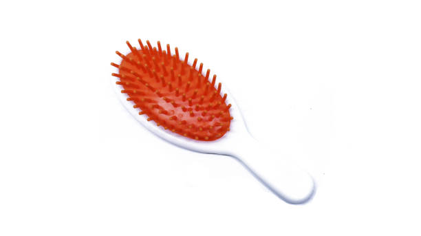 istock Orange hair comb isolated on white background 1330715066