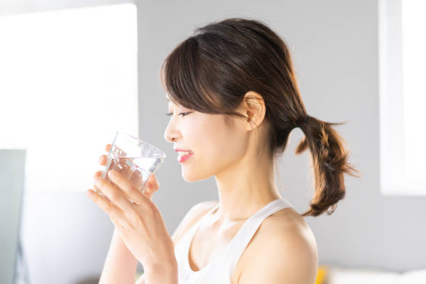 istock Young woman hydrating at home 1330716619