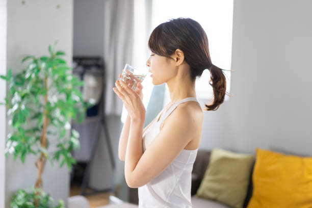 istock Young woman hydrating at home 1330716624