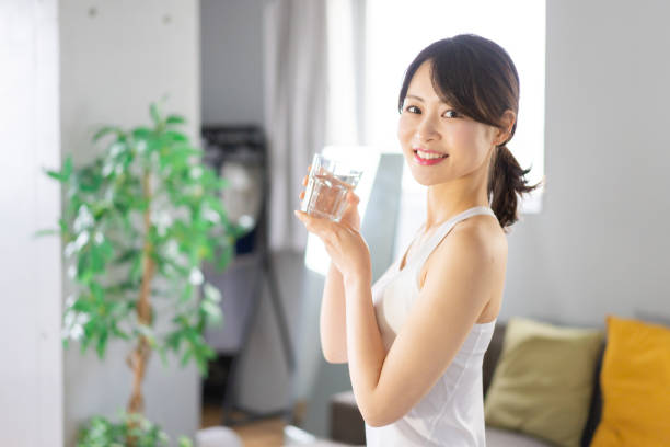 istock Young woman hydrating at home 1330716625