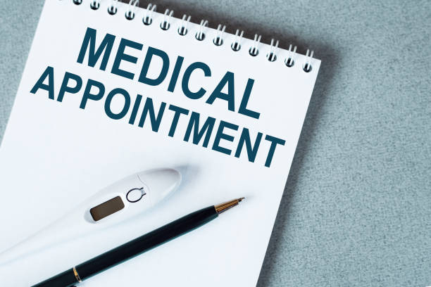 istock Blank notebook with thermometre and pen on table. MEDICAL APPOINTMENT text. 1330720721