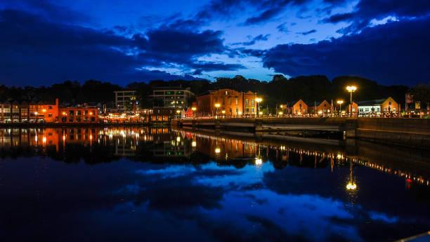 Westport, CT, USA - July 4, 2021: Westport evening reflections in Saugatuck river with dramatic sky
