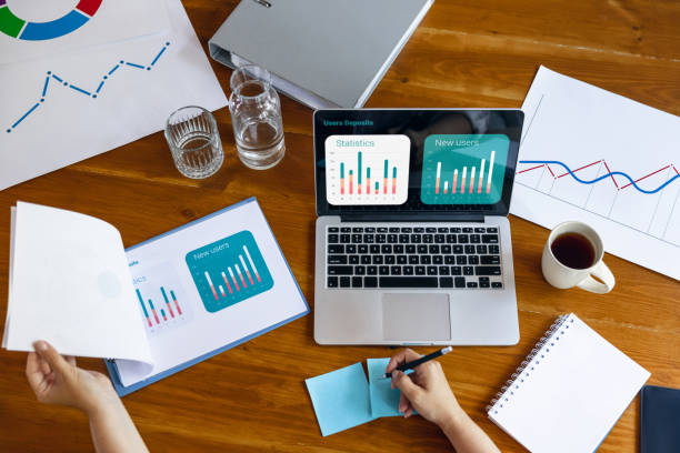 istock Young woman, manager working at office. Using laptop, modern gadgets. Remote working. Workplace at comapny, home with PC, devices. 1330722917