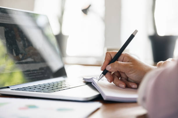 istock Young woman, ceo, manager working at office. Using laptop, modern gadgets. Remote working. Workplace at comapny, home with PC, devices. 1330723012