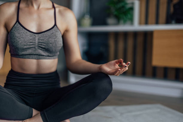 istock Young woman, relaxing while doing yoga. 1330723398
