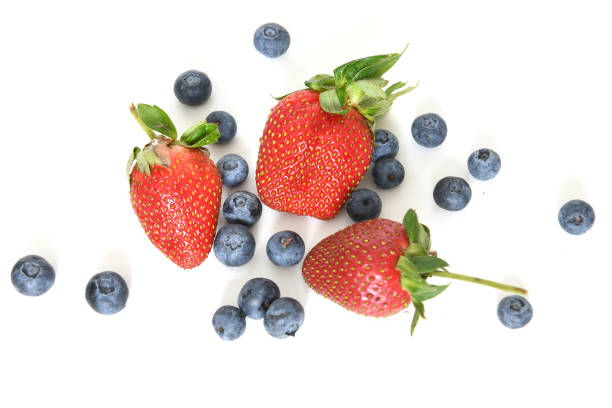 istock Summer berries. Strawberries and blueberries on light background 1330726778