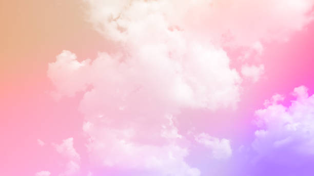 istock beauty sweet pastel soft pink with fluffy clouds on sky. multi color rainbow image. abstract fantasy growing light 1330726809