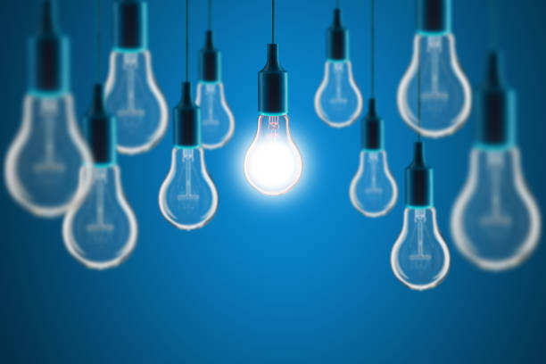 Idea and teamwork concept - Vintage incandescent bulbs on color background stock photo