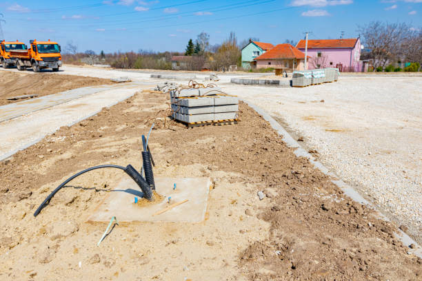 istock Corrugated pipe with cable coming out from the ground. 1330727682