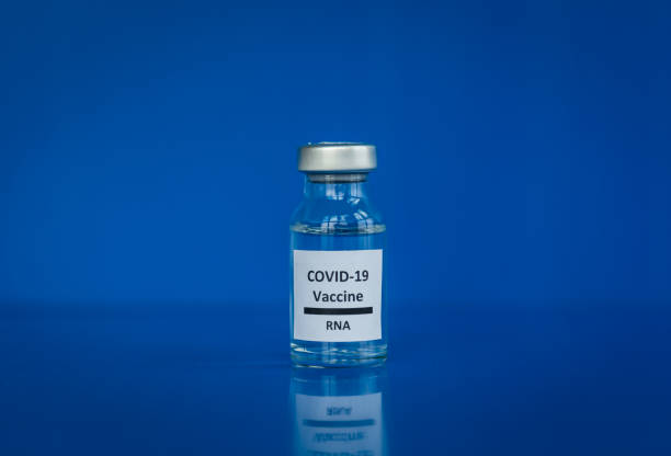 istock mRNA COVID-19 vaccine with blue background 1330729054
