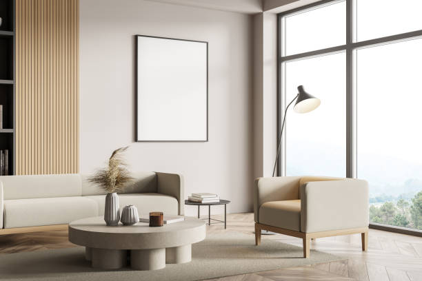 istock Minimalistic white living room corner with sofa, bookcase and coffee table 1330730485