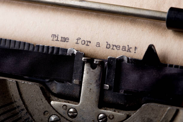 istock Time for a break - text message on the typewriter close-up 1330730660