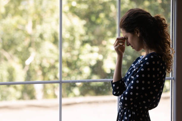 istock Unhappy desperate Latin woman touching head, feeling strong headache 1330730705