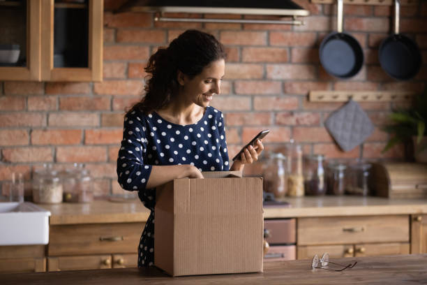 istock Happy shopper receiving purchase from internet shop 1330730736