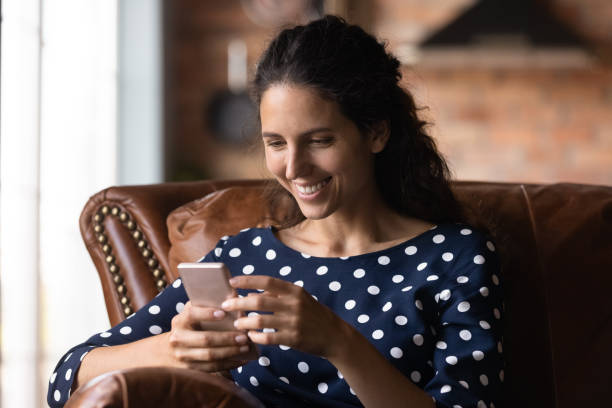istock Happy smartphone user getting message with good news 1330730742