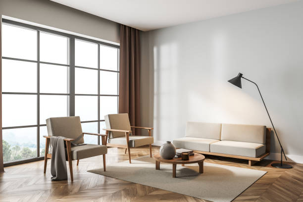istock Light living room interior with armchairs and sofa, panoramic windows 1330732901