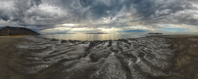 The Great Salt Lake, depleted by drought, hits its lowest water level in recorded history