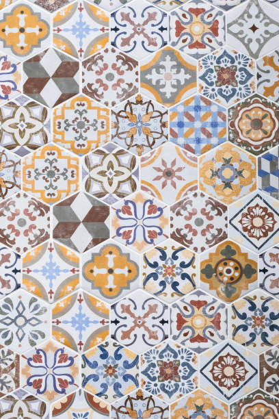 Mosaic ceramic tile, colorful wall texture, abstract pattern, design element. Vintage tile background. Azulejo ornament, floor surface. Tiled backdrop. Wallpaper. Painted tin-glazed ceramic tilework. stock photo