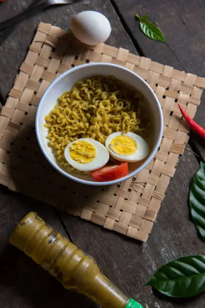 Instant maggi masala egg noodles in a bowl. Top view.
