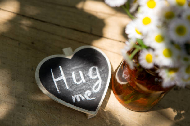 istock Hug me hand drawing phrase on a heart, Sharing a Hug concept 1330734825