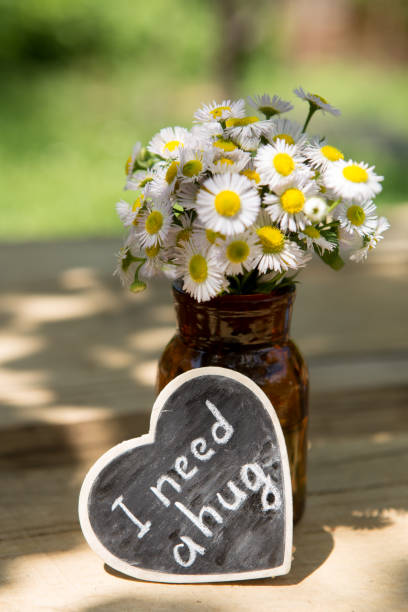 istock I need a hug hand drawing phrase on a heart, Sharing a Hug concept 1330736249