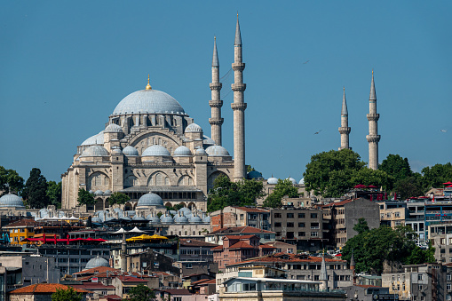 Istanbul, Turkey - April 17, 2021: Photo of the Suleymaniye Mosque with four thin minarets against a stormy sky